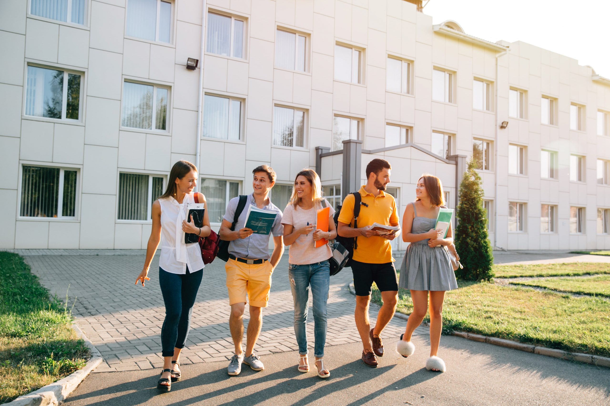 free-time-students-bachelor-s-campus-life-rhythm-five-friendly-students-are-walking-min-scaled.jpg